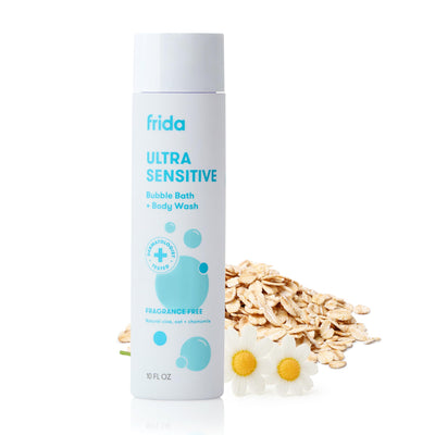 Frida Ultra Sensitive Bubble Bath & Body Wash bottle with oats and a flower on a white background