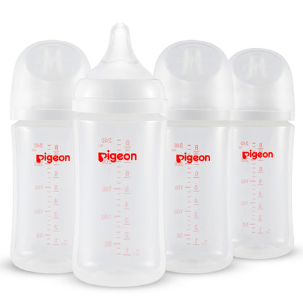 Four Pigeon baby bottles with measurement markings on a white background