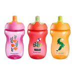 Three colorful sippy cups with animal illustrations on a white background