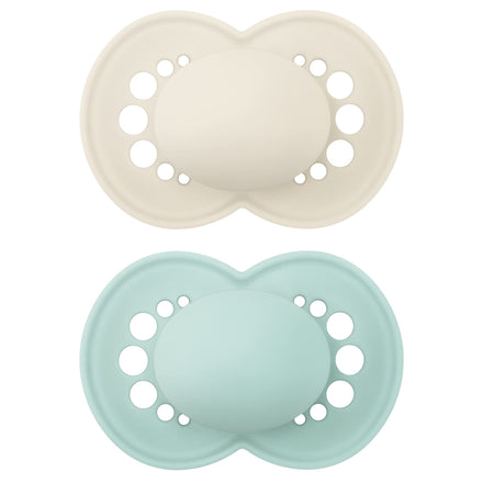 Two baby pacifiers, one beige and one light blue, on a white background.