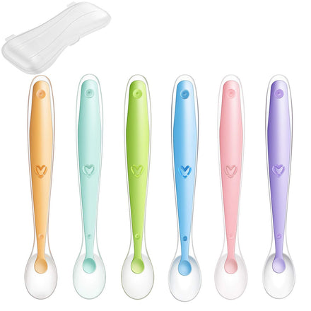 Set of six colorful baby spoons with heart designs on a white background