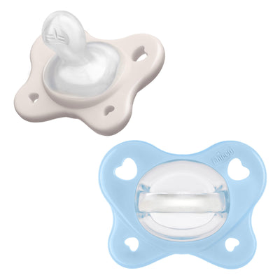 Two baby pacifiers, one pink and one blue, on a white background.