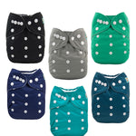 Set of six colorful cloth diapers with button closures on a white background