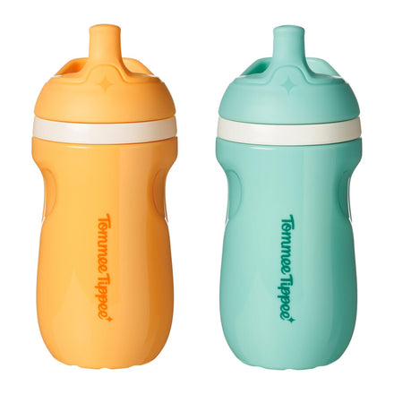Two sippy cups, one orange and one teal, with 'Tommee Tippee' branding on a white background.
