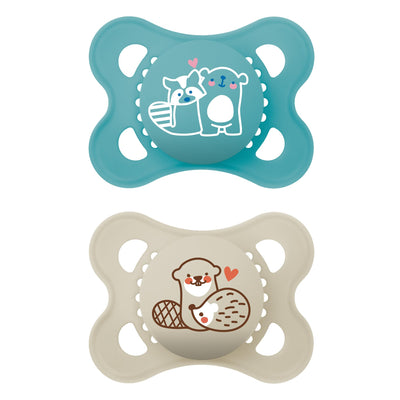 Two baby pacifiers with cartoon designs on a white background