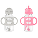 Two baby bottles with handles and pink and gray lids on a white background