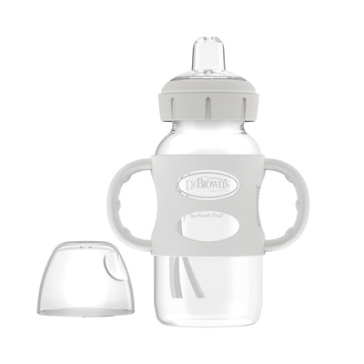 Glass baby bottle with handles and a clear cap on a white background, featuring the Dr. Brown's logo.