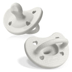 Two white baby pacifiers on a white background