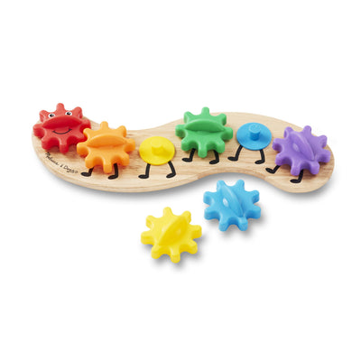 Colorful gear-shaped toys with a wooden base on a white background