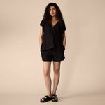 Motherhood Maternity Women's Casual Soft Stretchy Smocked Waist Lounge Pregnancy Shorts with Side Pockets, Black, Small
