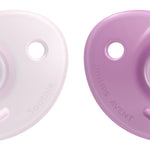Two baby pacifiers, one white and one purple, on a white background.