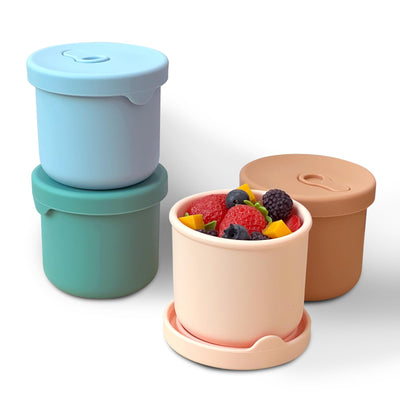 Set of colorful food containers with lids on a white background