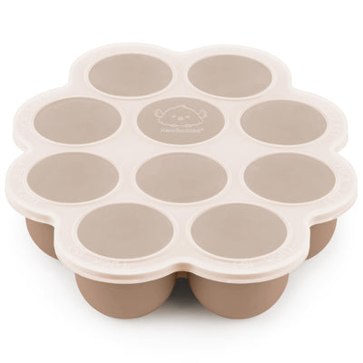 Beige silicone mold with circular compartments on a white background