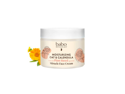 Babo Botanicals moisturizing cream jar with flowers on a white background