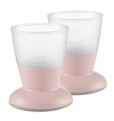 Two pink and white baby cups with a brand logo on a white background