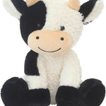 Plush cow toy with black and white pattern on a white background