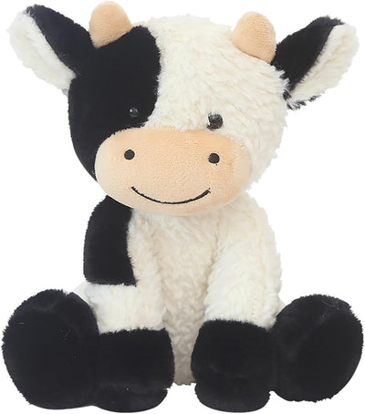 Plush cow toy with black and white pattern on a white background