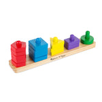 Colorful wooden stacking toy with geometric shapes on a white background