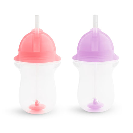 Two sippy cups with pink and purple lids on a white background