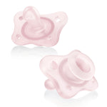 Two pink baby pacifiers on a white background