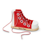 Red and white high-top sneaker with laces on a white background, featuring the Melissa & Doug logo.