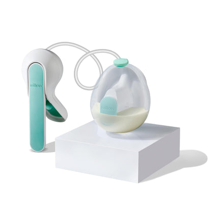 Breast pump with a clear container on a white background