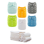 Set of colorful baby cloth diapers with a stack of white diapers below on a white background