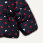 Amazon Essentials x Sofia Grainge Baby Girls' Water-Resistant Hooded Puffer Jacket, Navy Hearts, 18 Months