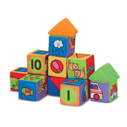 Colorful children's building blocks with various designs and numbers on a white background