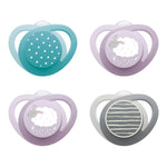 Four baby pacifiers with different designs on a white background