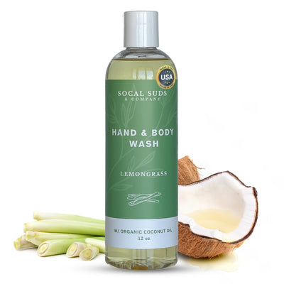 Bottle of Socal Suds & Company Lemongrass hand and body wash with lemongrass stalks and a coconut on a white background