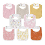 Set of colorful baby bibs with floral patterns on a white background