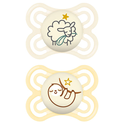 Two baby pacifiers with cartoon designs on a white background