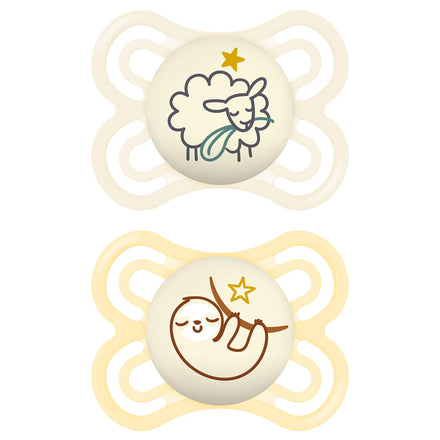 Two baby pacifiers with cartoon designs on a white background