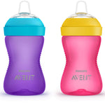 Two Philips Avent sippy cups, one purple with a blue lid and one pink with a yellow lid, on a white background.