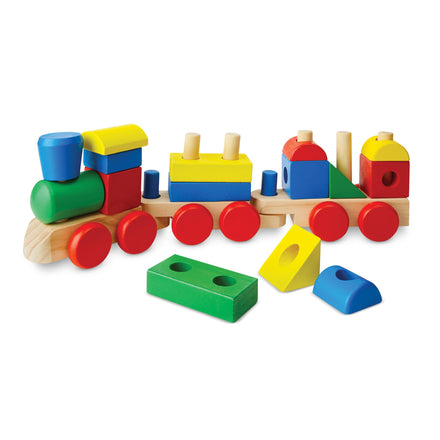 Colorful wooden toy train with blocks on a white background