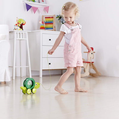 Hape Tito Pull Along | Wooden Turtle with Swirling Shell Pull Toddler Toy, Green