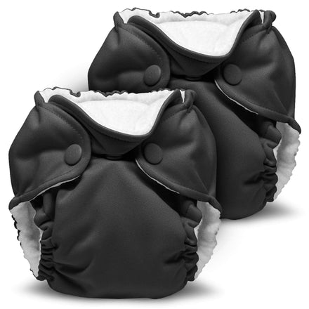 Two black cloth diapers with white interiors on a white background