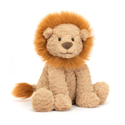 Plush lion toy on a white background