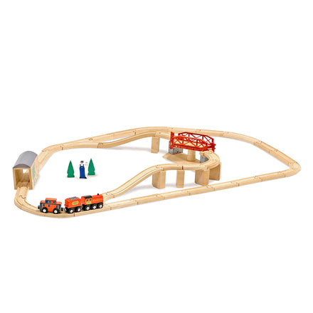 Wooden toy train set with tracks, bridge, and trees on a white background