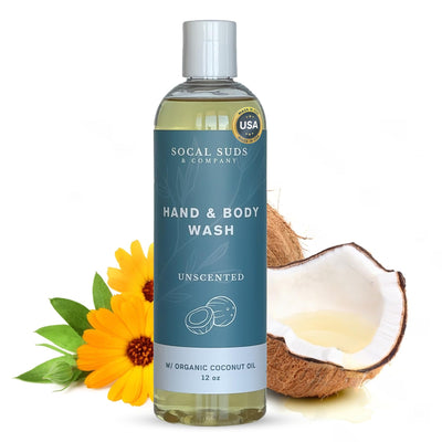 Hand and body wash bottle with coconut and flower on a white background