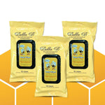 Three packages of Bella B baby wipes on a yellow and white background