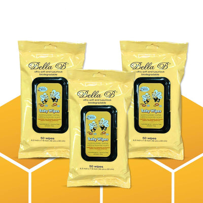 Three packages of Bella B baby wipes on a yellow and white background