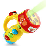 Colorful toy with buttons and a light on a white background