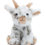 Plush toy goat with white and brown fur on a white background