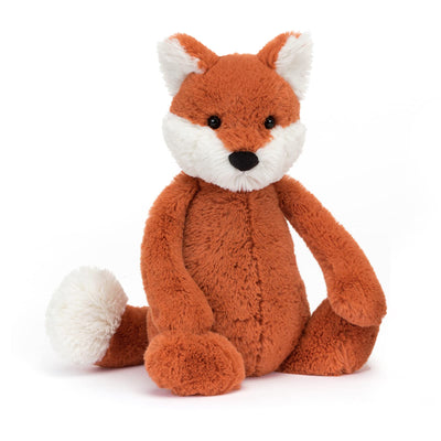 Plush fox toy on a white background