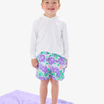 RUGGEDBUTTS Boys UPF50+ Stretch Swim Trunks - Purple Hydrangea Garden, 0-3m