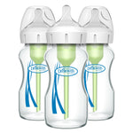 Three Dr. Brown's baby bottles with clear bottles and white caps on a white background