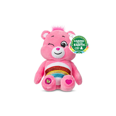 Pink plush bear with a rainbow design and heart on a white background