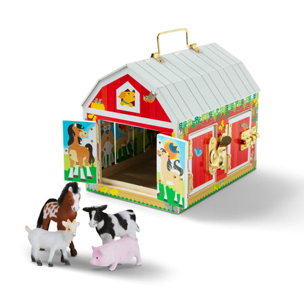 Toy barn with animal figures on a white background